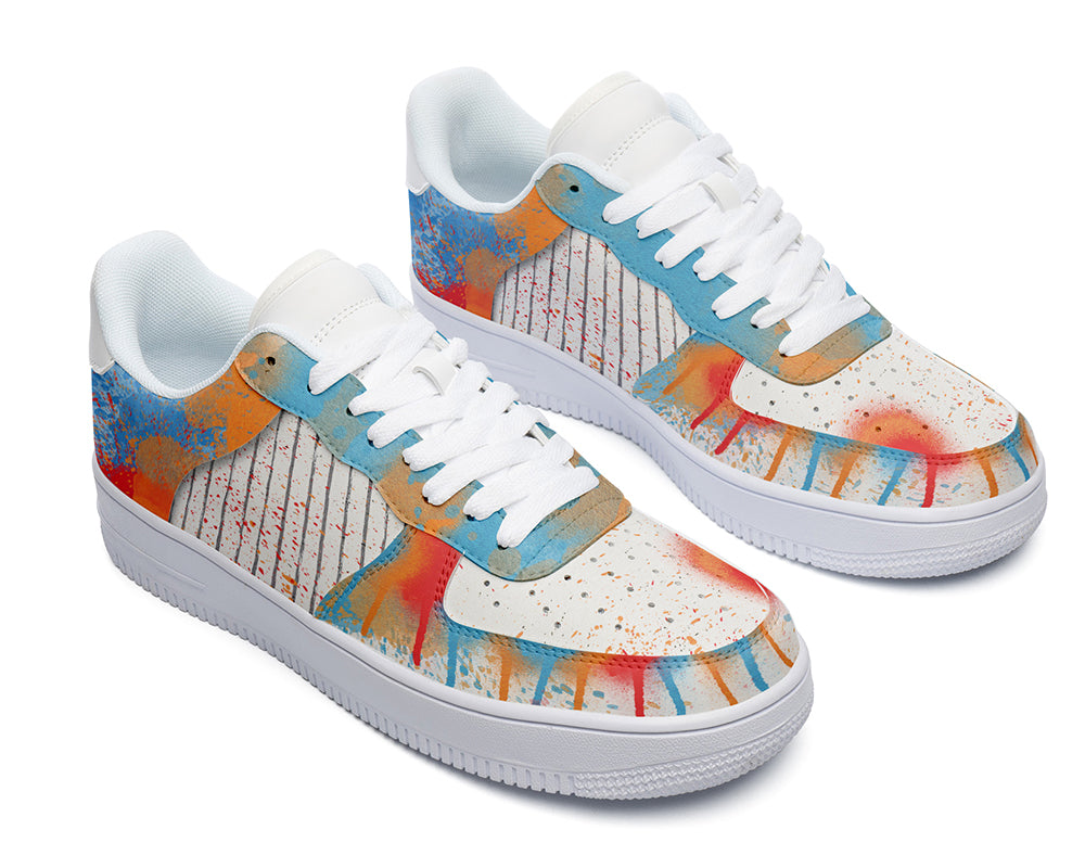 Court sneakers featuring colorful graffiti-inspired spray paint artwork with blue, orange, and red paint splatter details.