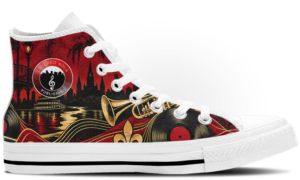 A high-top sneaker featuring a New Orleans jazz theme with red, black, and gold graphics, including a trumpet, vinyl records, and a fleur-de-lis, on a white background.