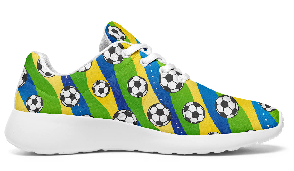 Brazil-inspired sport shoes featuring soccer ball patterns with green, yellow, and blue flag-inspired artwork.