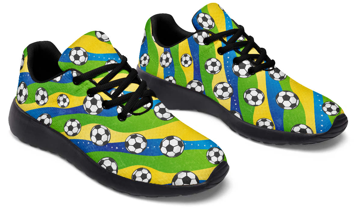 Brazil-inspired sport shoes featuring soccer ball patterns with green, yellow, and blue flag-inspired artwork.