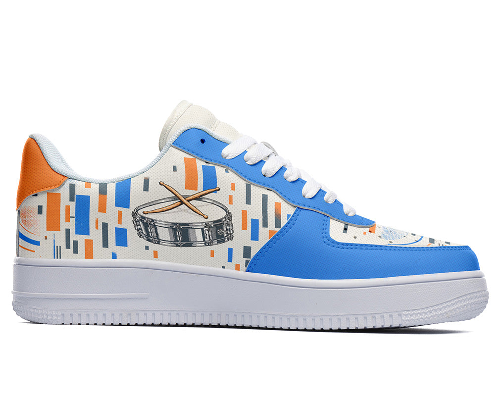 Court sneaker in white sole with a side view featuring a silver snare drum with drumsticks over blue and orange equalizer block patterns.