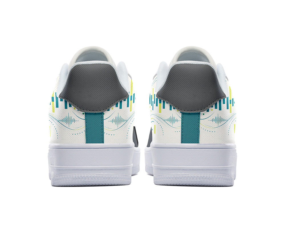 A pair of white low-top sneakers shown from the back, featuring a dark gray heel tab, a teal pull tab, and a teal and yellow soundwave graphic pattern on the sides.
