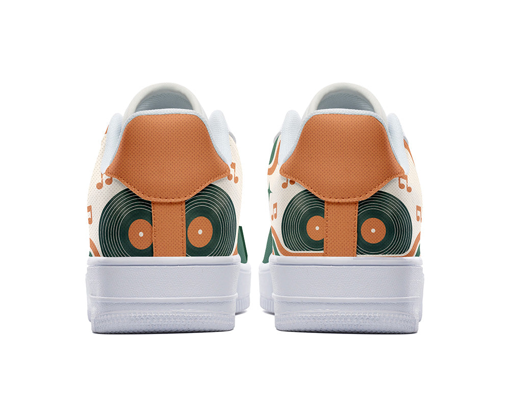 Court sneakers in white sole featuring a vintage gold microphone illustration over green and orange rainbow wave arches and music notes.