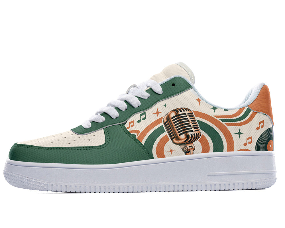 Court sneaker in white sole with a side view featuring a vintage gold microphone illustration over green and orange rainbow wave arches and music notes.