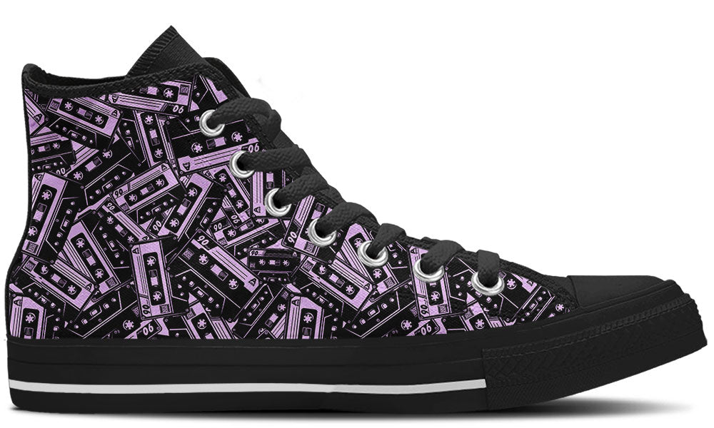 High Top sneaker in black sole with a side view featuring a repeating seamless pattern of purple and black retro cassette tapes.