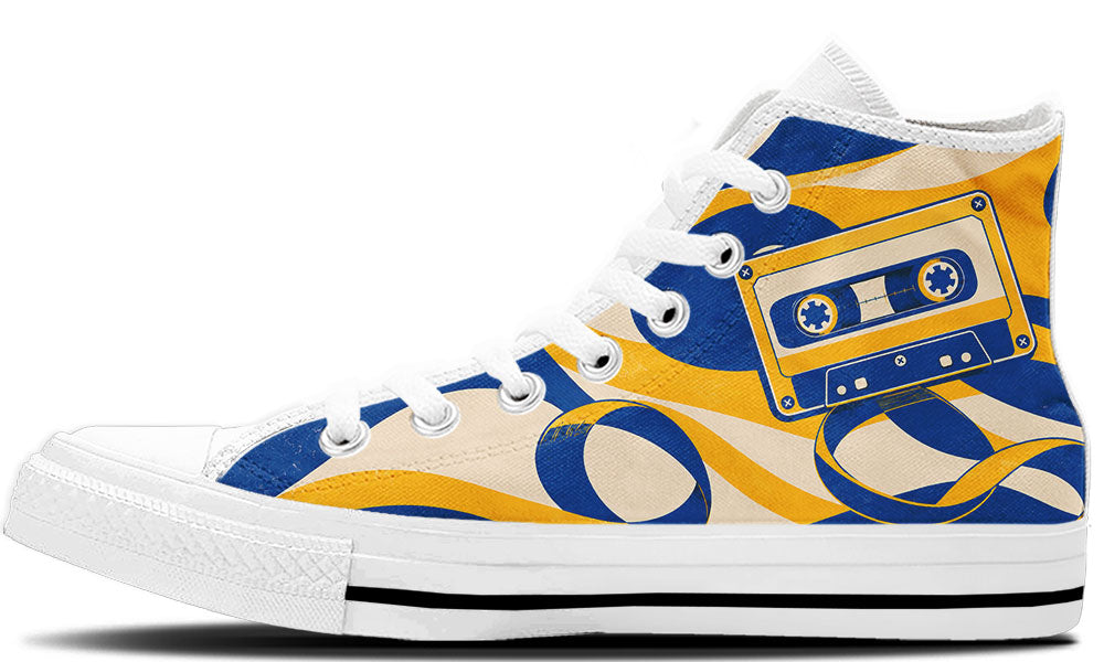 Classic high top sneaker featuring a blue and yellow cassette tape print with unraveling magnetic tape swirls, in white sole.