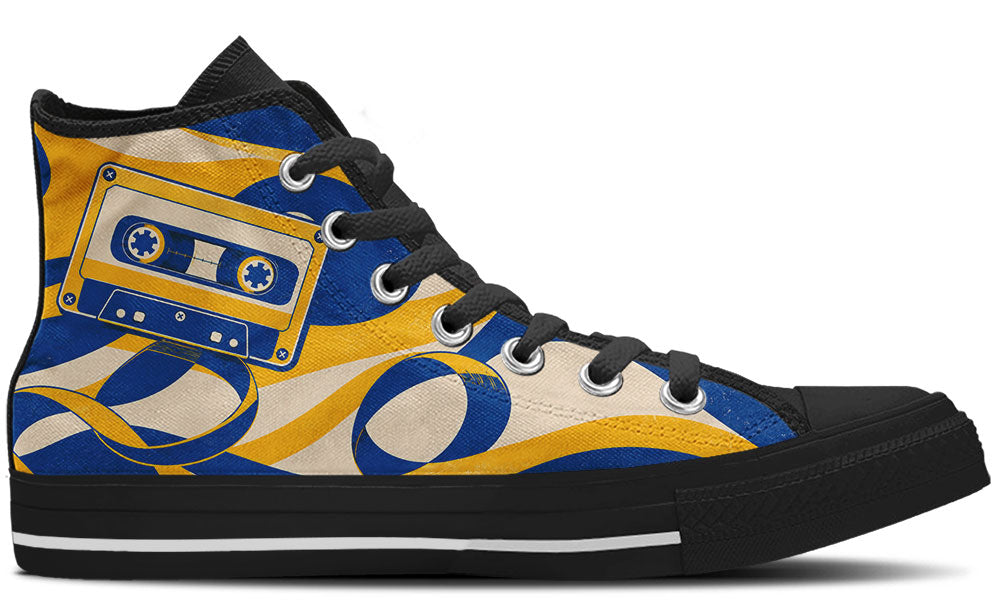 Classic high top sneaker featuring a blue and yellow cassette tape print with unraveling magnetic tape swirls, in black sole.